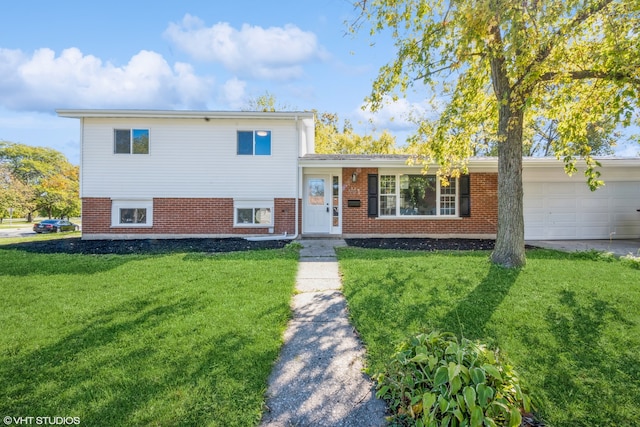 split level home with a front lawn and a garage