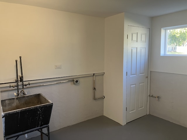 bathroom with sink and concrete flooring