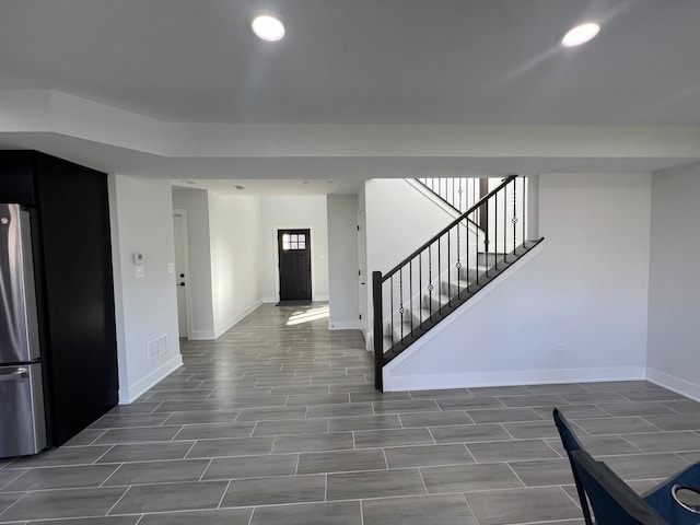 foyer entrance featuring dark wood-type flooring