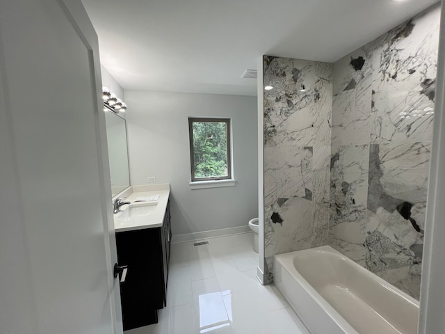 full bathroom featuring tile patterned flooring, vanity, toilet, and tiled shower / bath