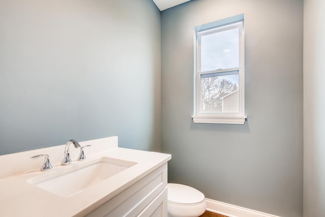 bathroom with toilet and vanity