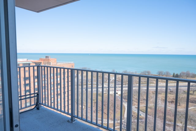 balcony featuring a water view