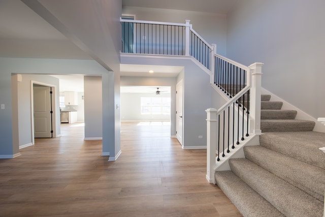 foyer with a high ceiling and light wood-type flooring