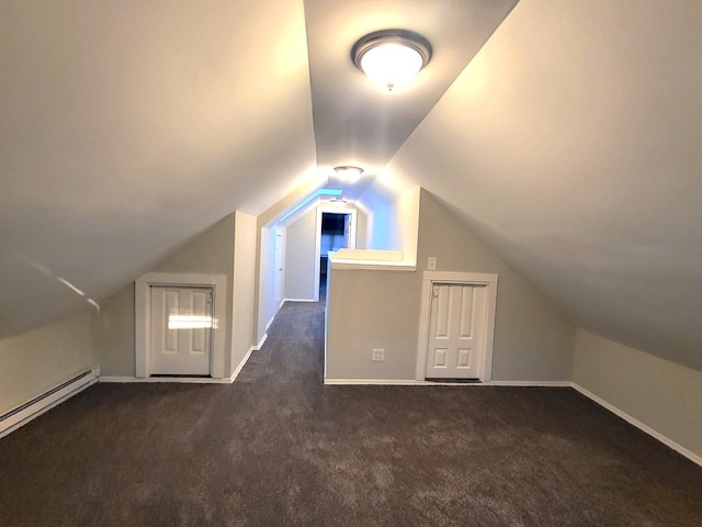 bonus room featuring a baseboard radiator, dark colored carpet, and lofted ceiling