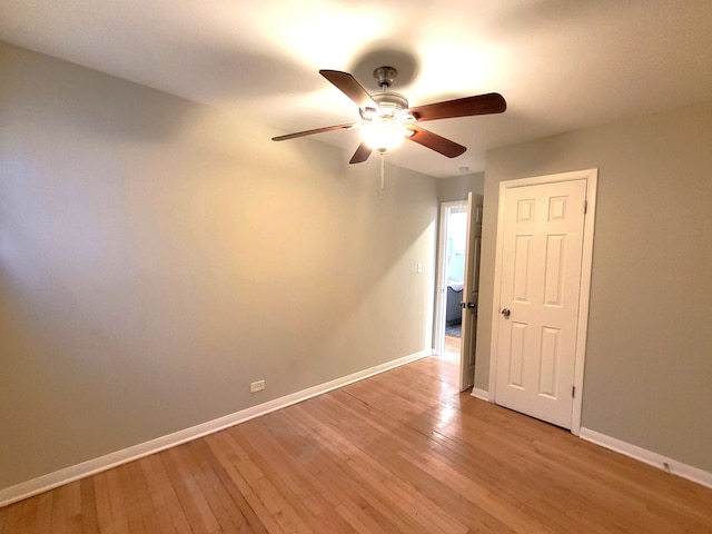 unfurnished room featuring ceiling fan and light wood-type flooring