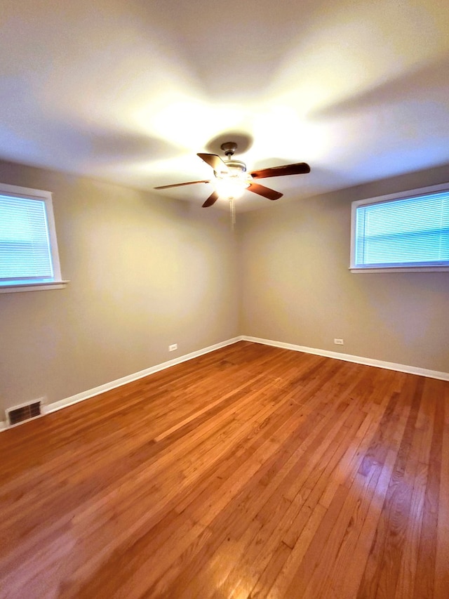 unfurnished room featuring wood-type flooring and ceiling fan