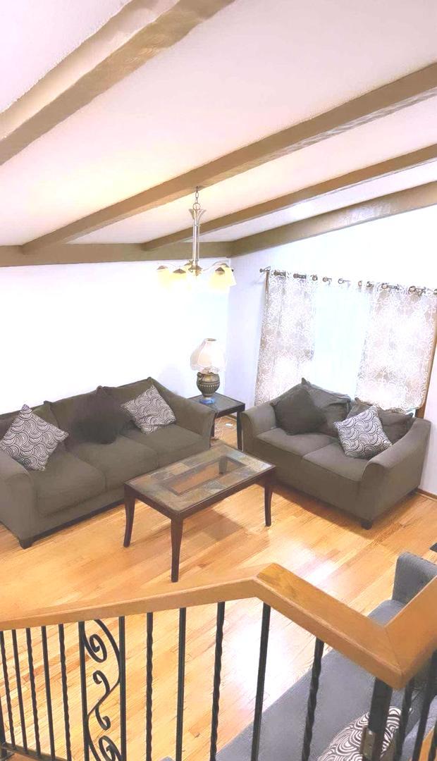 6151 Victoria Dr, Oak Forest, IL 60452 - living room with wood finished floors and beam ceiling
