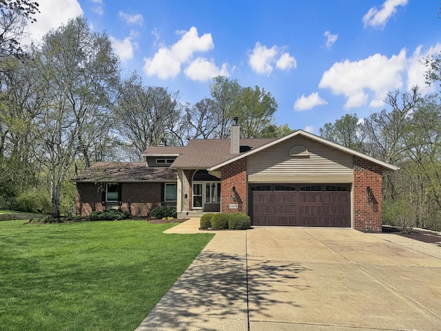 ranch-style home featuring a garage and a front lawn