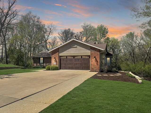 view of front of house with a lawn and a garage