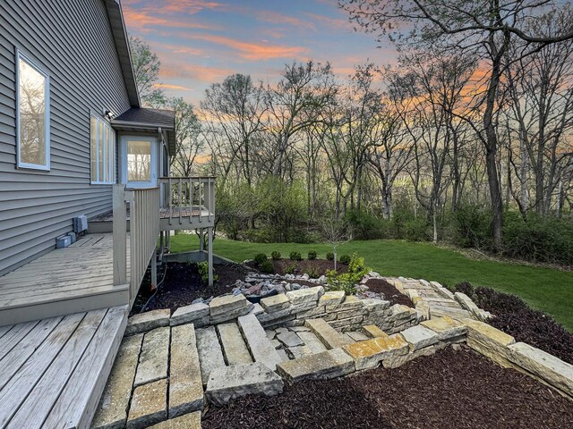 exterior space featuring an outdoor fire pit, a patio, and a yard