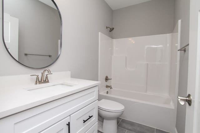 full bathroom with tile flooring, shower / washtub combination, toilet, and vanity