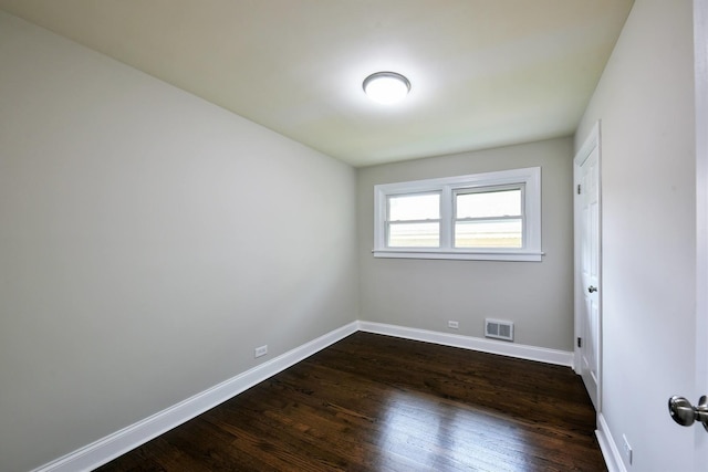 unfurnished room with dark hardwood / wood-style floors