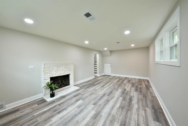 unfurnished living room featuring light wood-type flooring