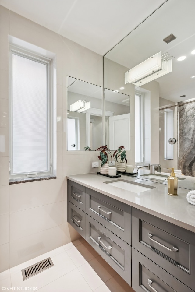 bathroom featuring tile floors and vanity