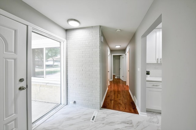 corridor with light tile flooring