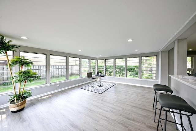 interior space with plenty of natural light and hardwood / wood-style floors