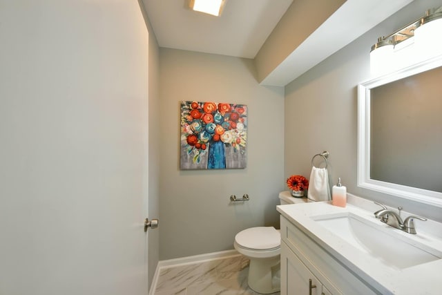 bathroom with toilet, tile flooring, and vanity