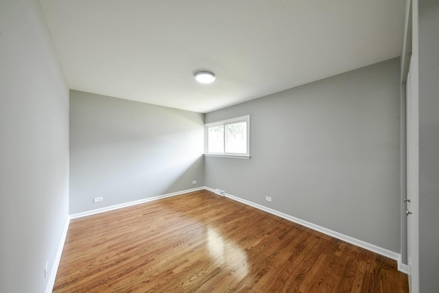 empty room with light hardwood / wood-style flooring