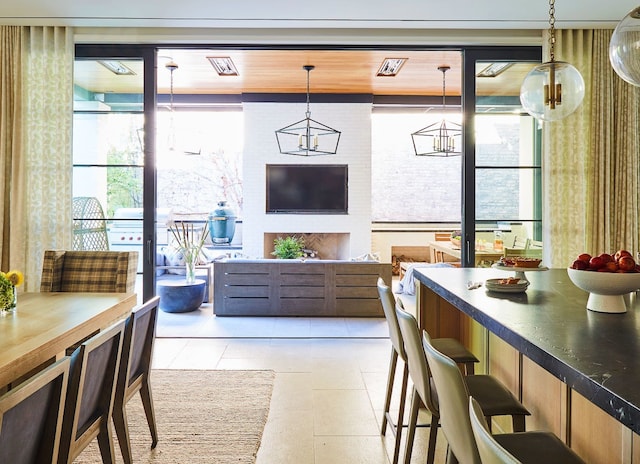 interior space featuring a chandelier and light tile flooring