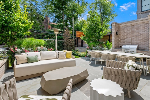 view of patio / terrace with area for grilling and outdoor lounge area