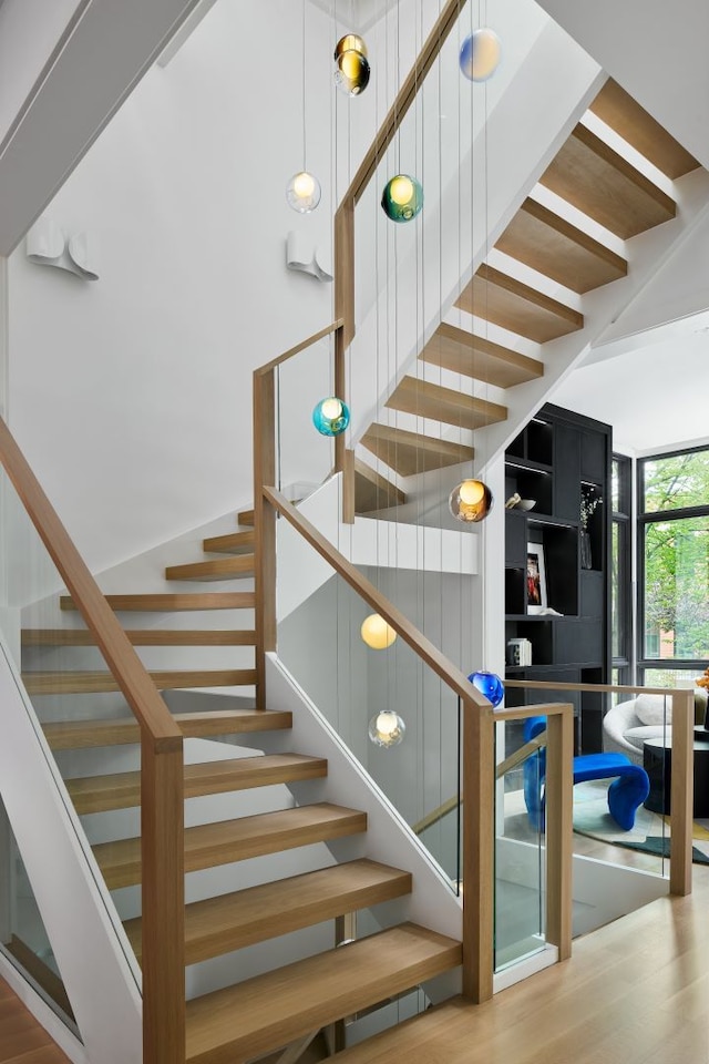 stairs with light wood-type flooring