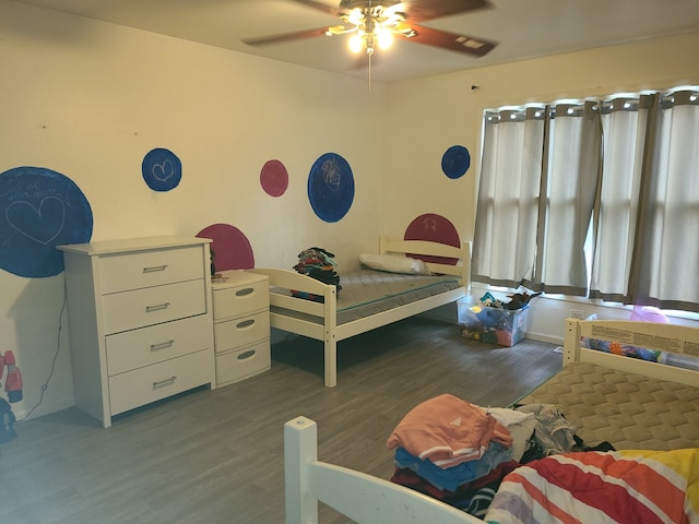 bedroom featuring dark hardwood / wood-style floors and ceiling fan