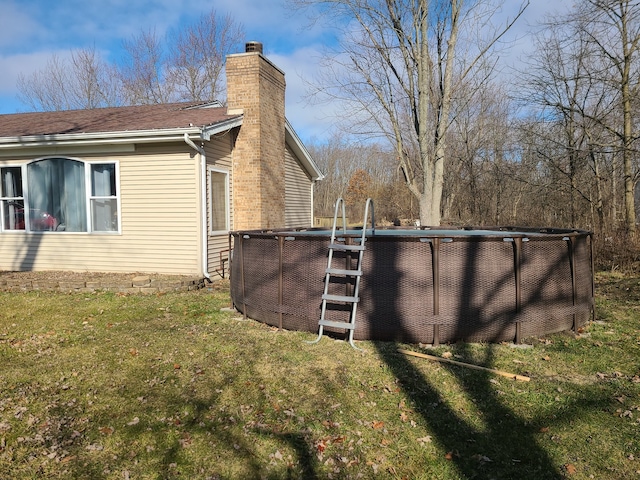 view of property exterior featuring a lawn