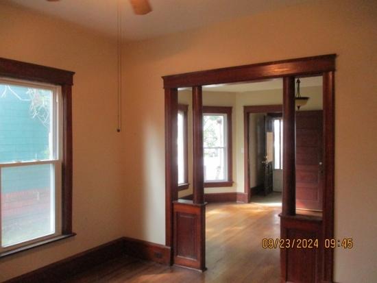 interior space featuring hardwood / wood-style floors and ceiling fan