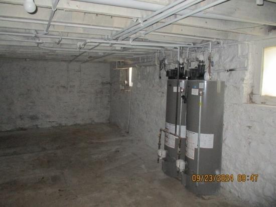 basement featuring water heater