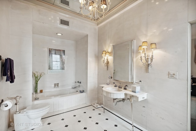 bathroom featuring an inviting chandelier, tile walls, tile floors, a bath to relax in, and toilet