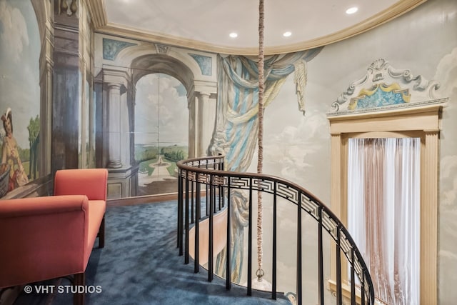 interior space with crown molding, dark carpet, and ornate columns