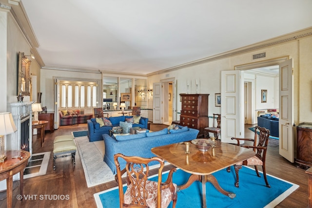 living room featuring crown molding and dark wood-type flooring