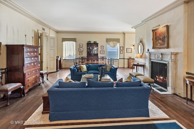 living room featuring dark hardwood / wood-style flooring and ornamental molding