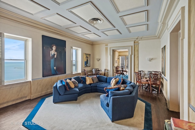 living room with dark hardwood / wood-style flooring, a water view, and coffered ceiling