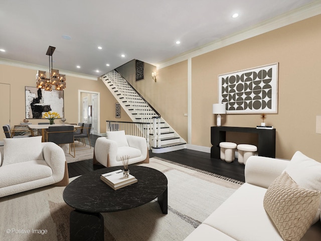 living room with a notable chandelier, ornamental molding, and hardwood / wood-style flooring