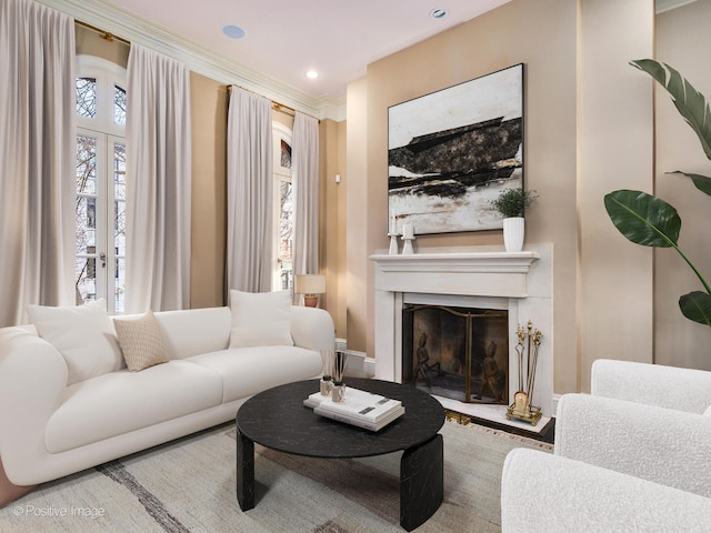 living room with plenty of natural light, french doors, and crown molding