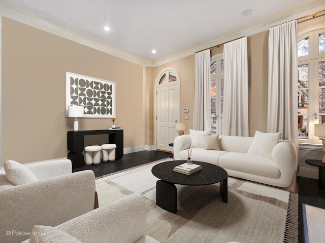 living room with hardwood / wood-style flooring and ornamental molding