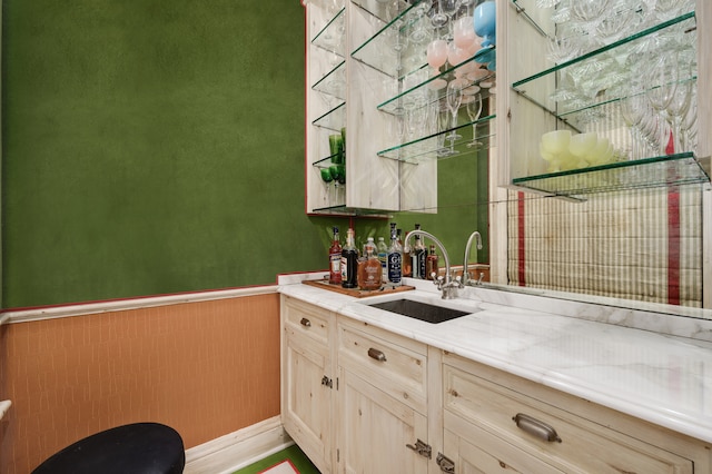 kitchen featuring sink and light brown cabinets