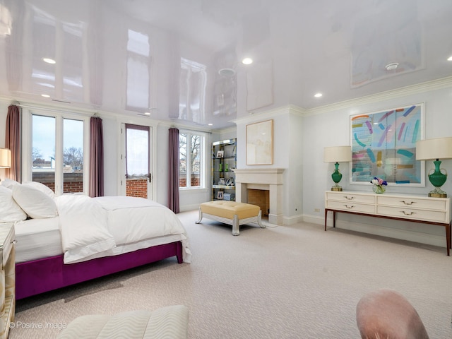 carpeted bedroom featuring multiple windows, access to outside, and ornamental molding