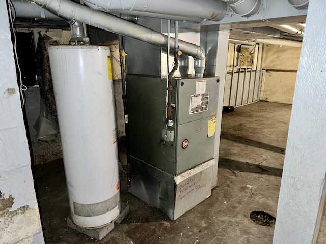 utility room with gas water heater