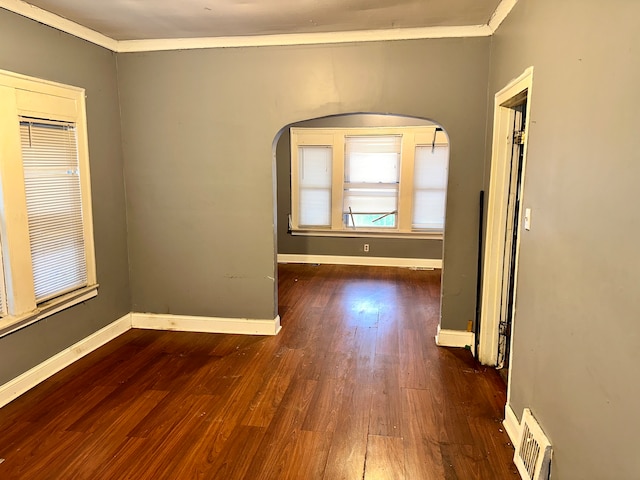 interior space with crown molding and dark hardwood / wood-style floors