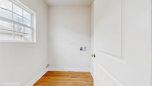 unfurnished room with baseboards and light colored carpet