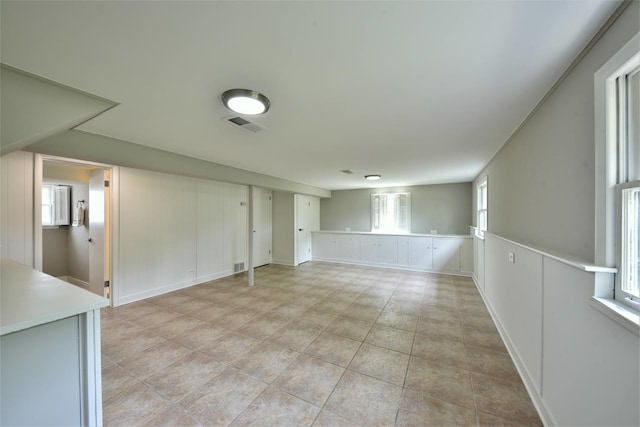 unfurnished room with light tile floors