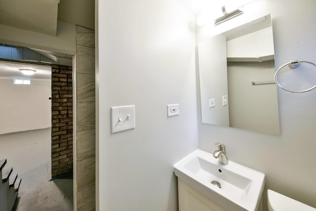 bathroom featuring toilet and sink