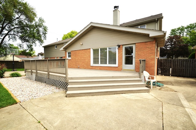 exterior space featuring a deck and a patio