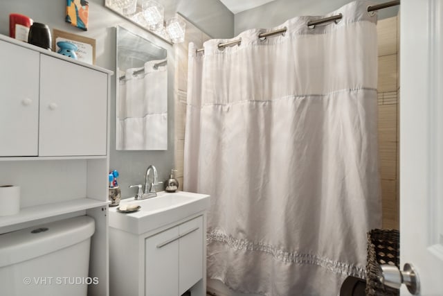 bathroom featuring toilet and vanity