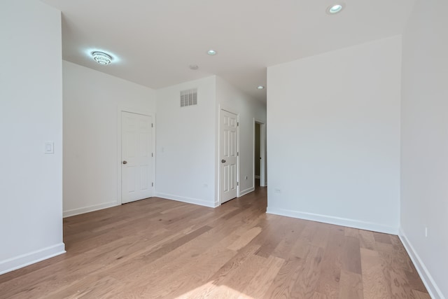 unfurnished room featuring light hardwood / wood-style floors