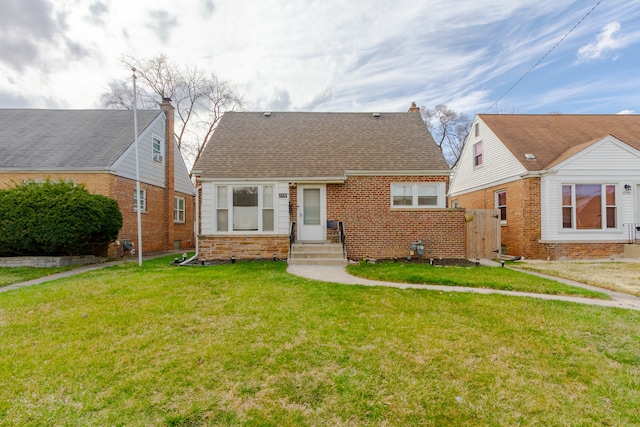 bungalow-style house with a front lawn