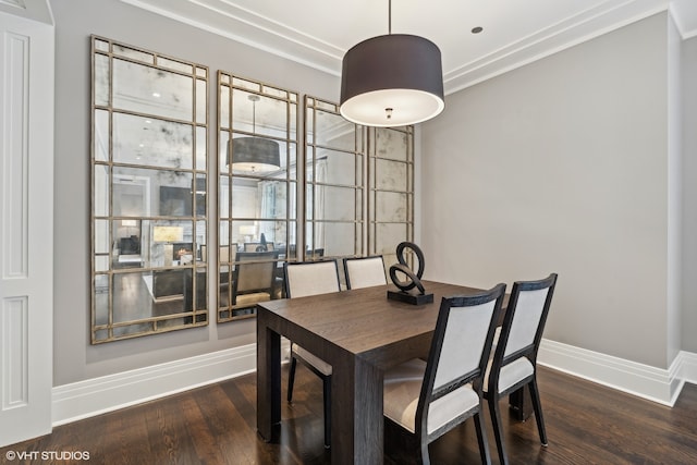 dining area with dark hardwood / wood-style flooring