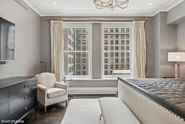 bedroom featuring dark hardwood / wood-style flooring, multiple windows, crown molding, and an inviting chandelier